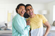 © Wavebreak Media - Diverse gay couple enjoys a playful moment at home