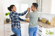 © Wavebreak Media - Diverse gay couple enjoys a playful moment in the kitchen