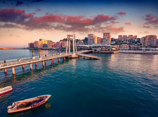 Wall Mural - Picturesque sunrise in Durres port, city on Adriatic Sea in western Albania, Europe. Stunning Adriatic seascape. Incredible spring scene of Albania. Traveling concept background.