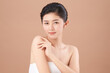 © kitthanes  - Beautiful young asian woman with clean fresh skin on beige background, Face care, Facial treatment, Cosmetology, beauty and spa, Asian women portrait.