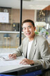 © Charlie's - Smiling young Asian businessman in modern office. handsome asian man happy and friendly while working success job