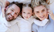 © Maass/peopleimages.com - Bed, above and portrait of parents with child for relax, resting and comfortable in morning. Happy family, home and mother, father and girl in blanket for bonding, relationship and love on weekend