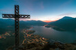 © Cavan Images - Lake Como at dawn view from summit cross on mountain peak, Italy