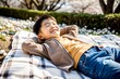 © N7 - Joyful Asian Boy Resting in Park