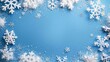 © Emin - Winter themed blue background with white snowflake border and space for text or images for Christmas season
