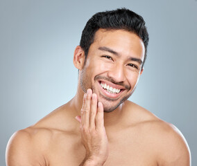Wall Mural - beauty, facial and grooming with portrait of man in studio on gray background for cosmetic wellness.