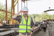 © JU.STOCKER - Portairt of Caucasian engineer man on construction site, Foreman worker checking project at precast concrete factory site
