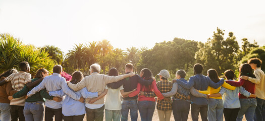 Poster - Group of multigenerational people hugging each others - Support, multiracial and diversity concept - Main focus on senior man with white hairs