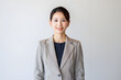 © dadakko - 30代から40代の日本人女性がスーツを着ているポートレート