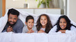 © peopleimages.com - Family, children and happy portrait with blanket for support, healthy relationship and security or love in home bedroom. Smile, parents and kids on mattress with cover, bonding time and relax in bed