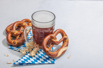 Wall Mural - Traditional Oktoberfest set. Pretzels and beer, German festival food concept. Trendy hard light