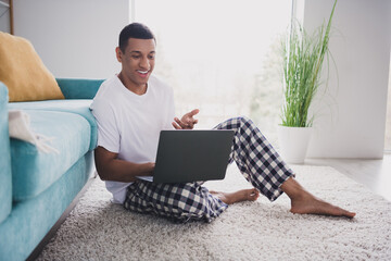 Sticker - Photo of cheerful positive guy sleepwear pajama staying home sofa video call modern device indoors house apartment room