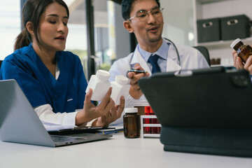 Wall Mural - doctor team, analysis the blood test examination results and medication usage of the patient on the 