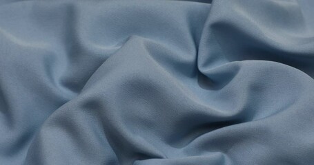 Wall Mural - Blue fabric background. Blue cloth waves background texture. Blue fabric cloth textile material.