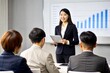 © N7 - Asian Businesswoman Explaining Concepts at Corporate Seminar