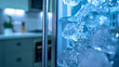 © Stefan - A close-up of fresh, transparent cubes of cold frozen ice with water droplets falling from the fridge, refrigerator or freezer in the background, in the kitchen of a house or apartment , summer.