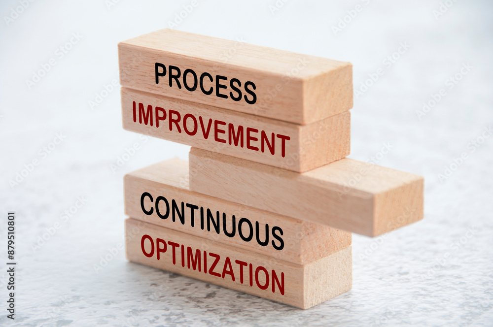 Process improvement and continuous optimization text on wooden blocks ...