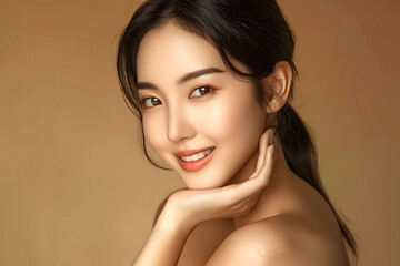 Portrait of a young Asian woman smiling with a natural beauty, light makeup, glowing skin, and elegant hairstyle, set against a beige background.	
