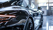 © Cadengo - A freshly detailed car gleams under the light, showcasing its immaculate shine and the protective ceramic coating