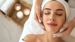 © AlfaSmart - A young woman receiving a soothing facial treatment from a professional aesthetician at a serene beauty clinic