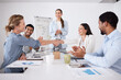© peopleimages.com - Applause, handshake and presentation with business people in boardroom of office for strategy together. Coaching, development or workshop and employee group shaking hands in workplace for deal