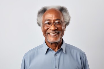 Poster - Portrait of a smiling afro-american man in his 70s sporting a breathable hiking shirt while standing against minimalist or empty room background