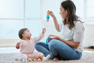 Canvas Print - Home, mom and baby with toys for playing, bonding and and child development on floor in nursery. Relax, mother and infant daughter on carpet together with games for growth, motor skills and learning