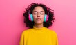 © Jullia - Serene Young Woman Enjoying Music with Vibrant Pink Headphones on a Pink Background