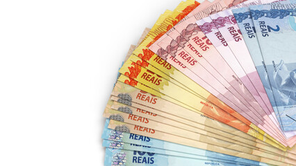 Fan arrangement of Brazilian Real currency banknotes in various denominations