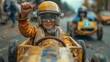 © svastix - A young boy wearing glasses and protective gear is raising his fist in joy while participating in a kart race, conveying excitement and youthful exuberance.