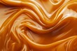 © MUNUGet Ewa - syrup for caramel in liquid form. caramel paste background. caramel-colored curl. The feel Top view, up close. Sweet Cream