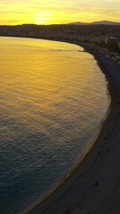 Wall Mural - View of coastline of the city in the French Riviera at sunset. Vertical, Nice, France