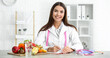 © Pixel-Shot - Portrait of female nutritionist in her office