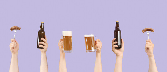 Many hands with beer and sausages on lilac background