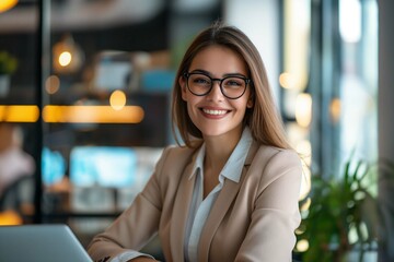 Portrait of happy businesswoman with touchpad in office