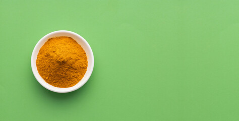 Sticker - Organic turmeric powder in the bowl - Curcuma longa