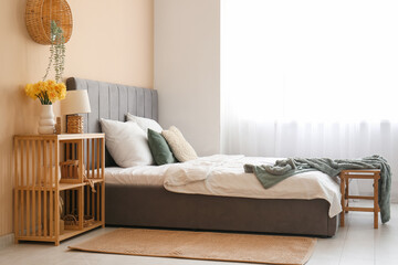 Sticker - Stylish bed, shelving unit and lamp in bedroom