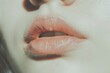 © ArtSpree - Close up of the mouth of a Caucasian woman biting off a piece of porous chocolate. Three-quarter front view. Low angle view.. Beautiful simple AI generated image in 4K, unique.