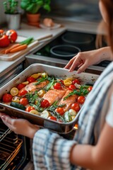 Canvas Print - Woman is holding pan with dish of food in it