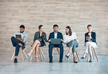 Canvas Print - Business people, recruitment or working in office with tech for interview, collaboration with onboarding on chair. Group, row or corporate company with staff diversity for hr, inclusion or teamwork