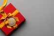 © Rayhanbp - gold medal with a yellow ribbon is placed on a red box, on a gray background, with a clean and simple design