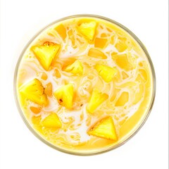 A frothy mango pineapple smoothie with coconut milk swirls, garnished with fresh pineapple chunks, in a tall glass