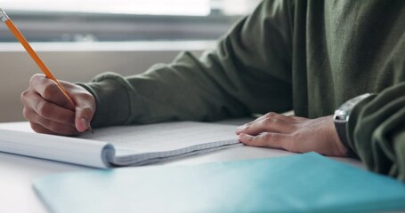 Poster - Student, hand and writing on desk for education with learning, development and scholarship in classroom. Closeup, boy and notes for assessment with knowledge, essay summary and studying in academy