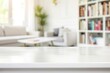 © ttonaorh - Empty white marble table with bookshelf and plant in living room