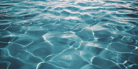 Wall Mural - Photograph of the water surface of an outdoor pool, light blue in color with some ripples and small waves