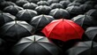 © Achmad Khoeron - Red umbrella stand out from the crowd of many black and white umbrellas. Business, leader concept, being different concepts