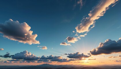 Wall Mural - Sunset over Mountains with Clouds.