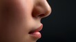 © AnyPic289 - A close-up of a nose and lips with smooth skin texture
