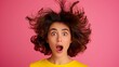 © Nataliia_Trushchenko - A woman with a messy hairdo and a surprised expression on her face. Concept of chaos and disarray, as if the woman's hair has been blown around by a strong gust of wind