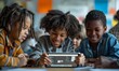 © Georgii - Three children engaged in learning with a tablet in a classroom setting